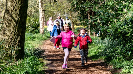 A family with young children on the Easter trail at Beningbrough Hall, North Yorkshire